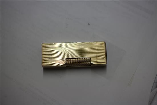 A 1960s 9ct gold Dunhill lighter, approx. 2.5in.
